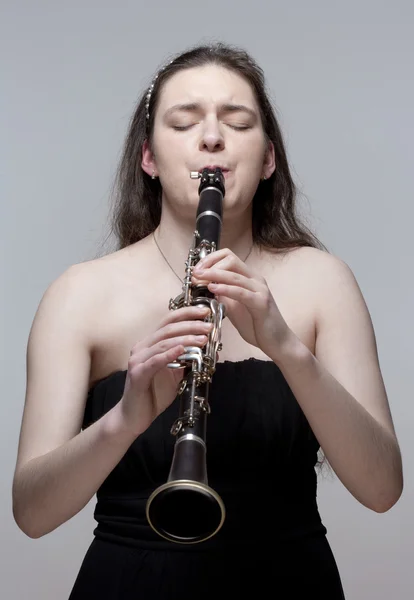 Young Female Musician Playing Clarinet