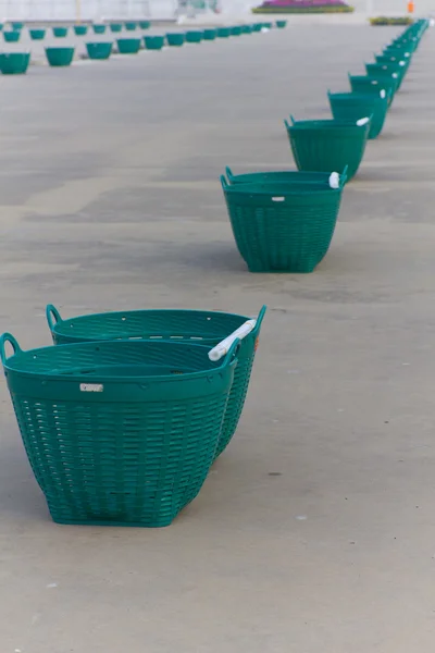 Empty plastic garbage baskets