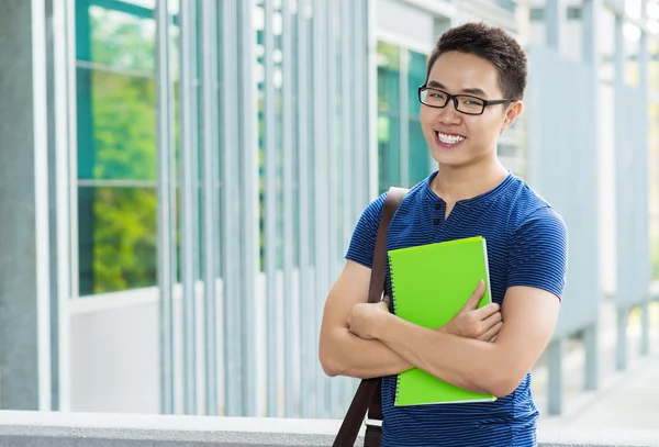 Vietnamese student with a textbook