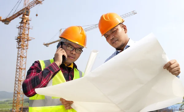 Construction builder looking at plans