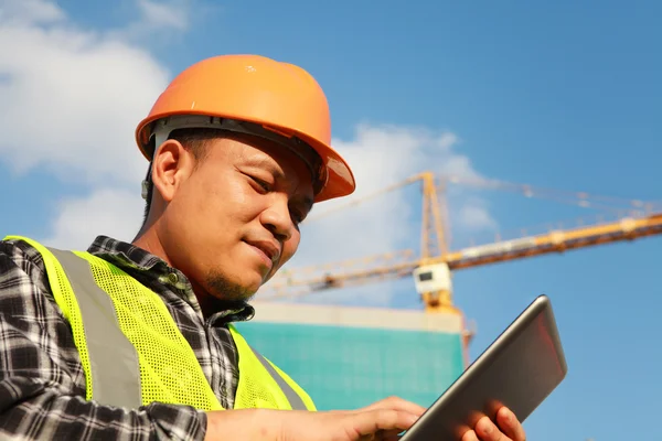 Construction worker using digital tablet