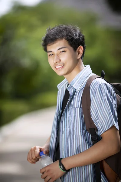 Young asian student in the park