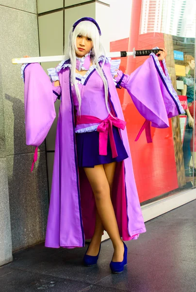 Bangkok - March 30 : An unidentified Japanese anime cosplay pose