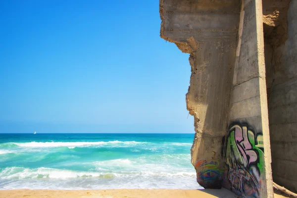 Graffiti on a wall by the sea