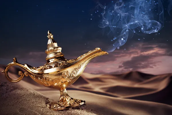 Magic Aladdin's Genie lamp on a desert