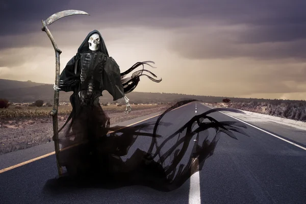 Grim reaper, angel of death on a meadow