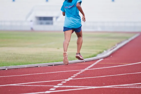 Cropped image of  runner on competitive running