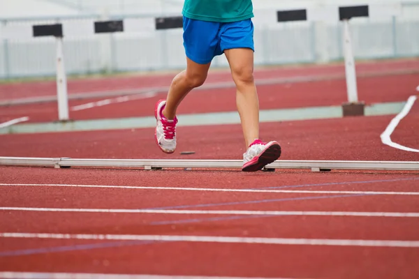 Cropped image of  runner on competitive running