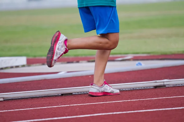 Cropped image of  runner on competitive running