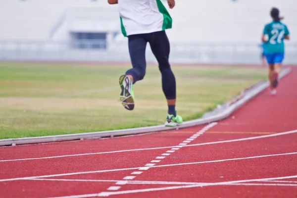 Cropped image of  runner on competitive running