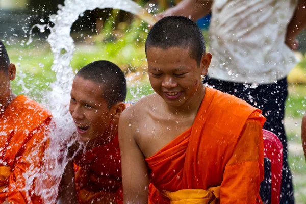 Water pouring to hands monk in Songkran festival on april 13,201