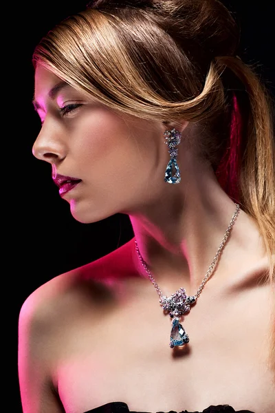 Beautiful fashion model posing in exclusive jewelry. Profession