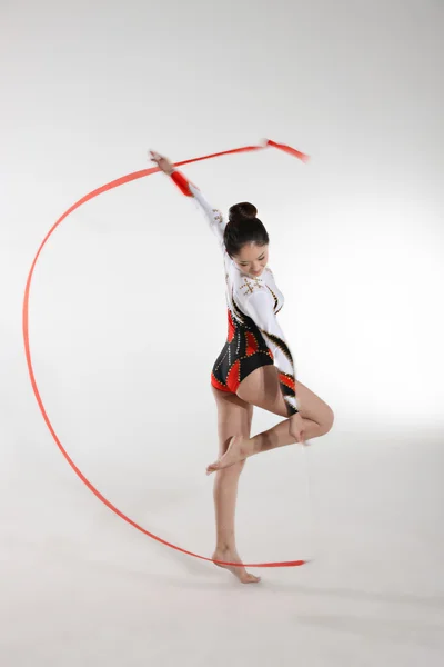 Young woman doing rhythmic gymnastics