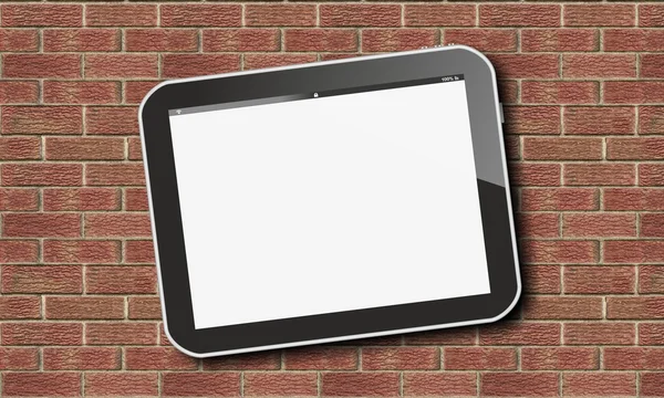 Tablet pc on red brick stone wall