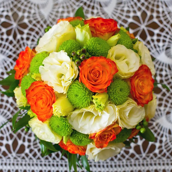Wedding bouquet of yellow and white and orange roses