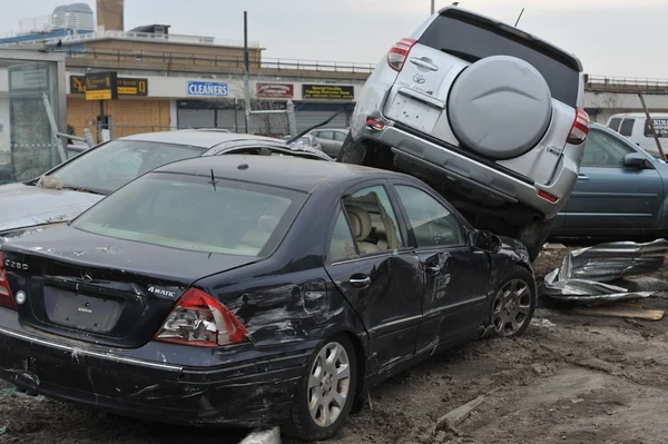 QUEENS, NY - NOVEMBER 11: Deamaged cars at parking lot in the Rockaway due to impact from Hurricane Sandy in Queens, New York, U.S., on Novemeber 11, 2012.