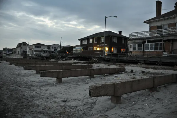 QUEENS, NY - NOVEMBER 11: Damaged homes and boardwalk aftermath recovery in the Rockaway beach area due to impact from Hurricane Sandy in Queens, New York, U.S., on November 11, 2012.