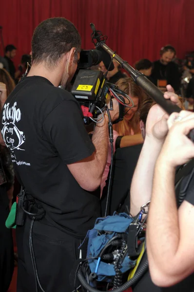 NEW YORK - NOVEMBER 10: Victoria\'s Secret video camera crew shoots backstage during the 2010 Victoria\'s Secret Fashion Show