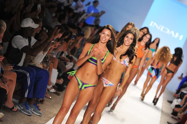 Models walks runway at the Indah Swimwear Collection