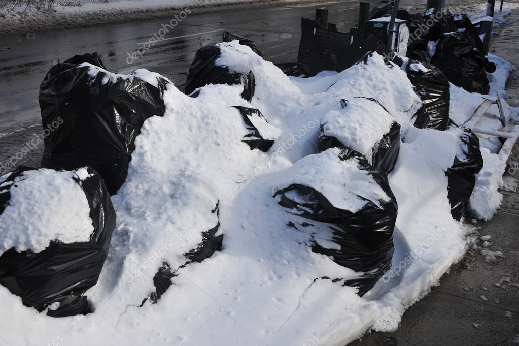 Garbage bags under snow — Stock Photo © fashionstock 38177813