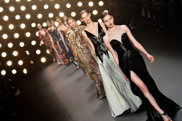 Model walks runway at Naeem Khan collection