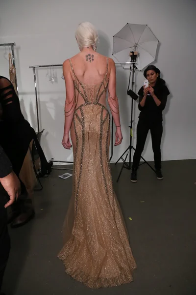 Designer Dany Tabet works backstage