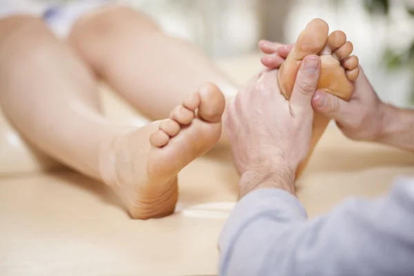 Physio therapist giving a foot massage