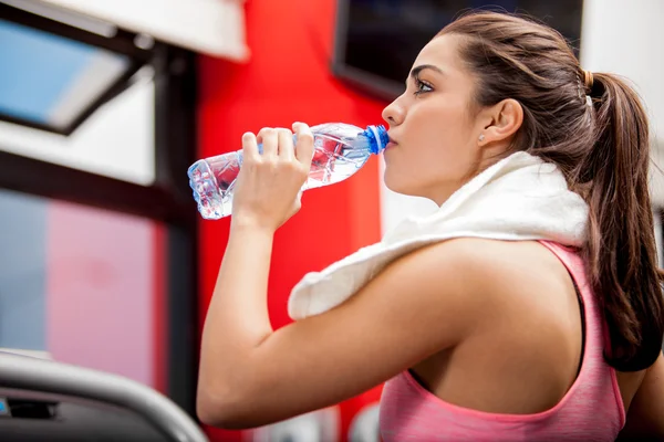 Athlete drinking water after a workout