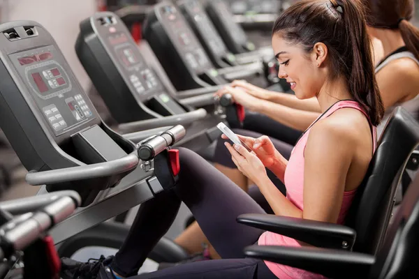 Girl practicing on the simulator with a mobile phone