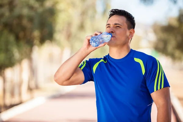 Drinking water in a running track