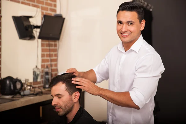 Hispanic barber at work
