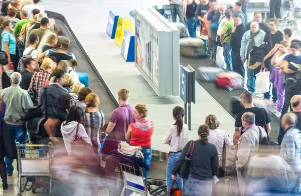 Lots of getting luggage at airport.