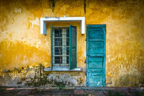 Old and worn house on street in Vietnam.