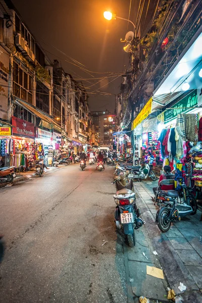 Street life of Hanoi at night in Vietnam, Asia.