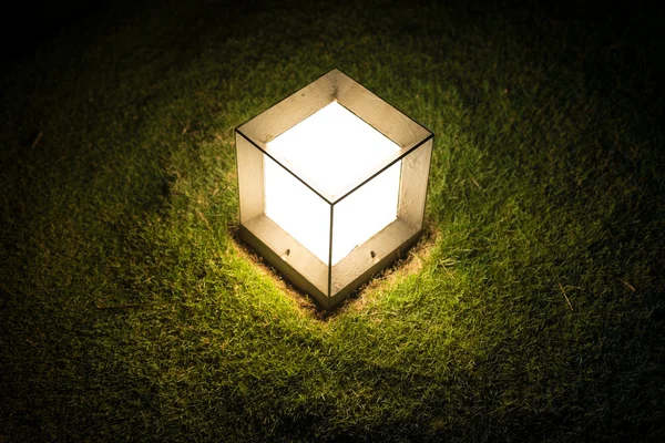 Lighting cube lantern on grass