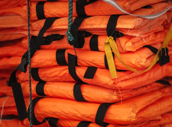 Pile of life-jackets ready for shipping