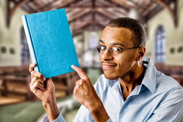 Nerdy black male with book
