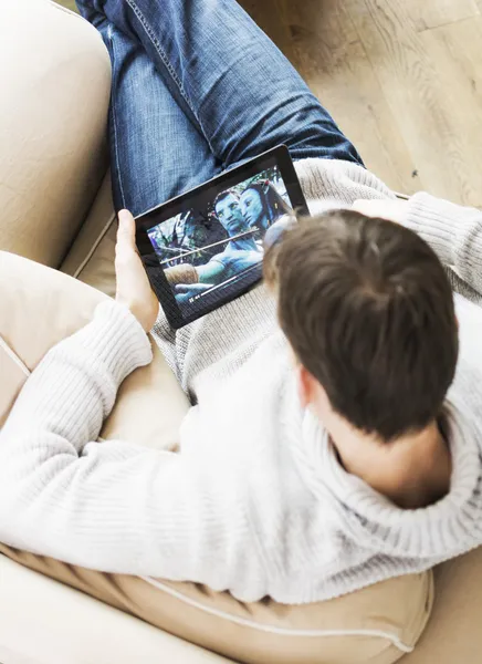 Man watching movie on tablet pc