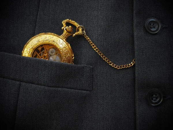 Golden Pocket Watch with Black Men\'s Waistcoat