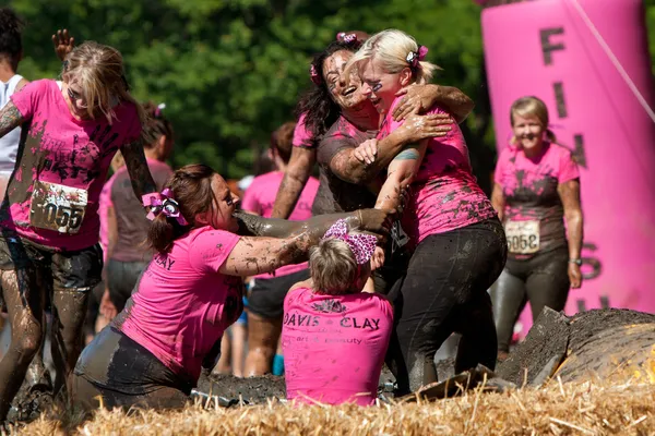 Women Play Around In Mud Pit Of Obstacle Course Run