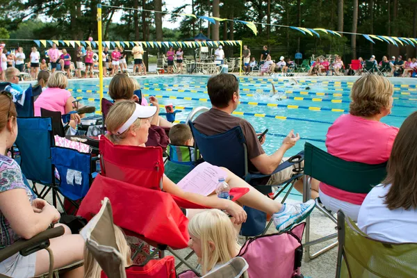 Parents And Spectators Watch Neighborhood Swim Meet