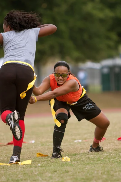 Woman Practices Flag Football Techniques