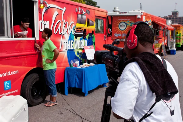 Cameraman Shoots Reporter Interviewing Food Truck Employee In At