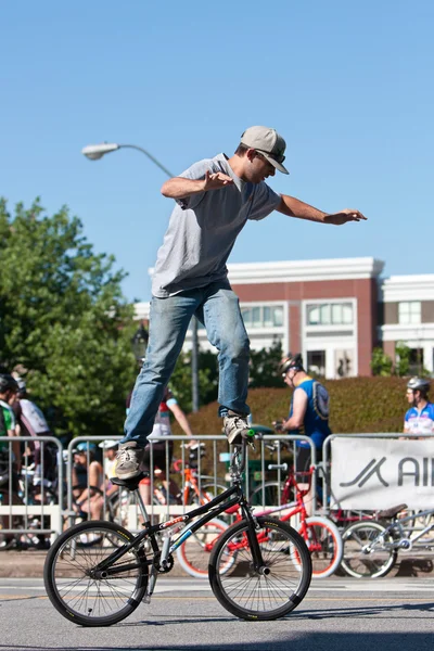 Man Practices Flatland Bike Tricks Before BMX Competition