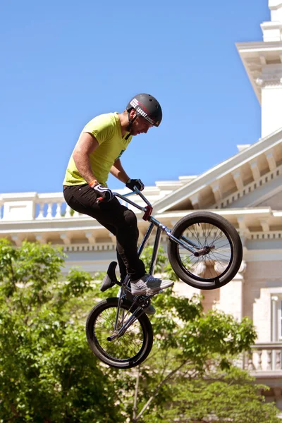 Young Man Practices Bicycle Ramp Jumps At BMX Competition