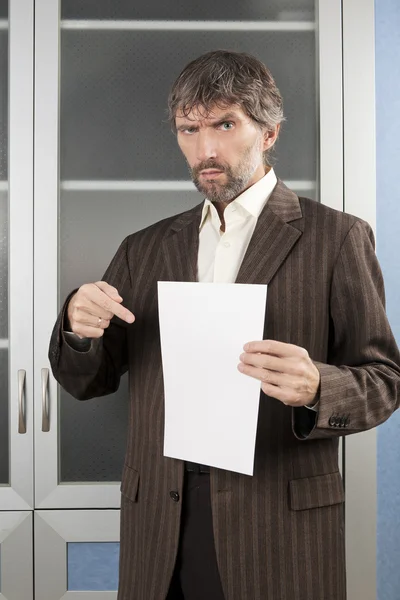 Angry man shows blanc sheet of paper