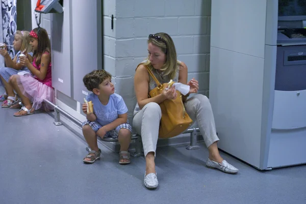 Mom and son eat sitting