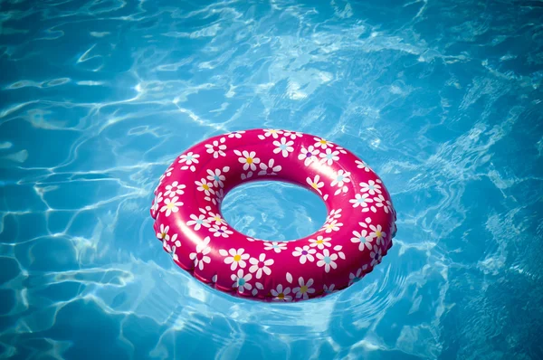 Summer theme. Inflatable rubber ring in water.