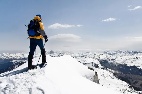 Climber at the top of mountain