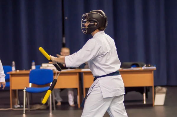 Kobudo competition men with nunchaku